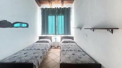 Letto o letti in una camera di Villetta bordo piscina vista mare Wi-Fi Gratis