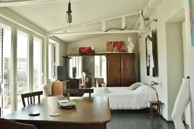 Letto o letti in una camera di Mini Attico panoramico con terrazza