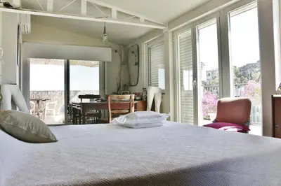 Letto o letti in una camera di Mini Attico panoramico con terrazza