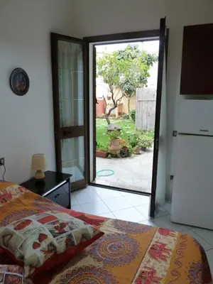 Letto o letti in una camera di Casa vacanze Rose E Fiori Sardegna