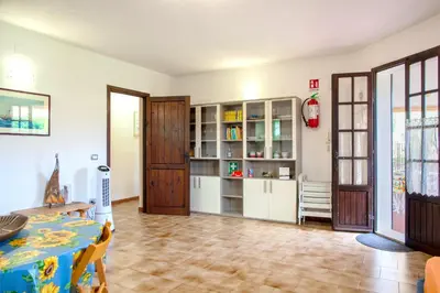 Cucina o angolo cottura di Mira Holiday Apartment - Chia CIN IT11101CR