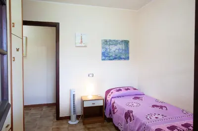 Letto o letti in una camera di Mira Holiday Apartment - Chia CIN IT11101CR