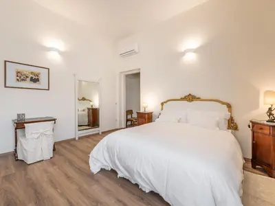 Letto o letti in una camera di B&B Palazzo Merello