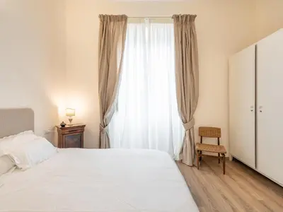 Letto o letti in una camera di B&B Palazzo Merello