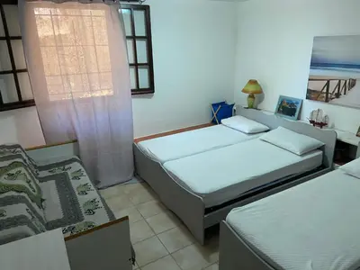 Letto o letti in una camera di CALA SINZIAS, 150 mt dalla splendida spiaggia