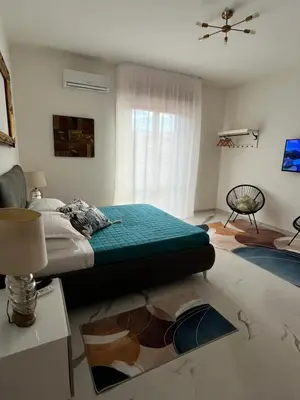 Letto o letti in una camera di Central home Cagliari