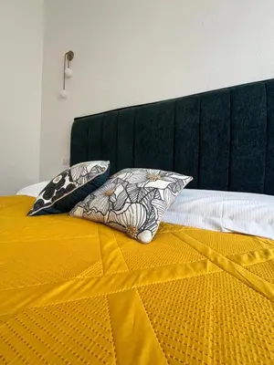 Letto o letti in una camera di Central home Cagliari