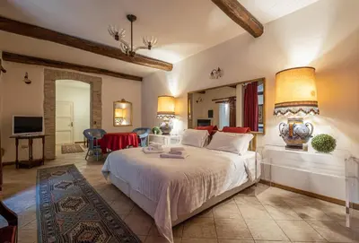 Letto o letti in una camera di Corte Cristina & Suites