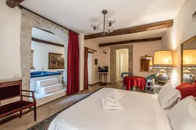 Letto o letti in una camera di Corte Cristina & Suites