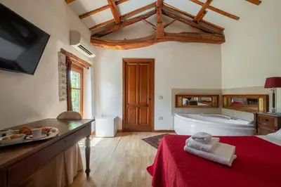 Letto o letti in una camera di Corte Cristina & Suites