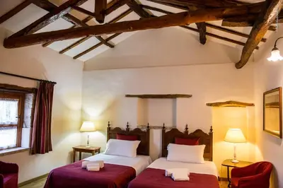 Letto o letti in una camera di Corte Cristina & Suites