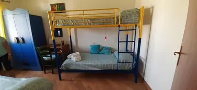 Letto o letti in una camera di VILLA IBISCO