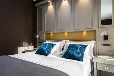 Letto o letti in una camera di Palazzo Doglio