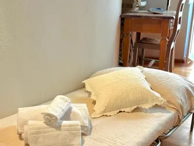Letto o letti in una camera di Castelletto Suites