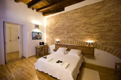 Letto o letti in una camera di Castelletto Suites