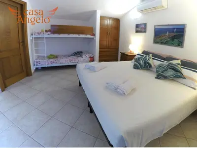Letto o letti in una camera di Casa Angelo