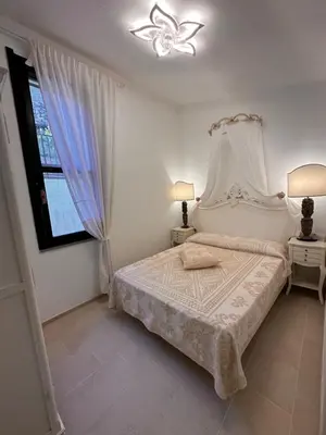 Letto o letti in una camera di Villa Sardinia Seaview&SPApool