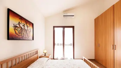 Letto o letti in una camera di Case Vacanza Baia Chia Aiosardegna