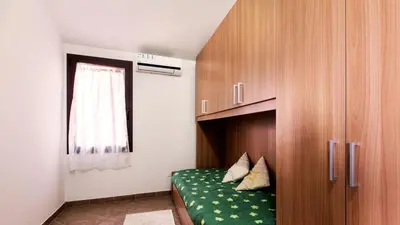 Letto o letti in una camera di Case Vacanza Baia Chia Aiosardegna