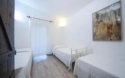 Letto o letti in una camera di Villa Eucaliptus