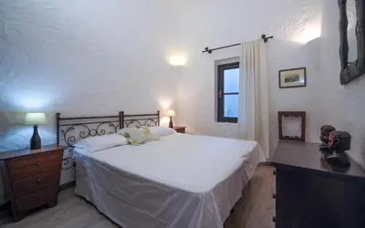 Letto o letti in una camera di Villa Eucaliptus