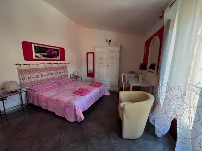 Letto o letti in una camera di Locazioni Brevi La RosaViola GUEST ROOMS