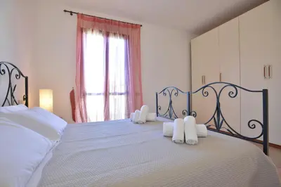 Letto o letti in una camera di IzzHome Crispi