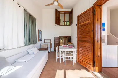 Area soggiorno di Domus Moon Apartment with sea view Villasimius