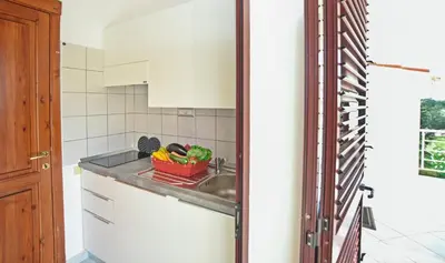 Cucina o angolo cottura di Su Nenneri Beach Apartment