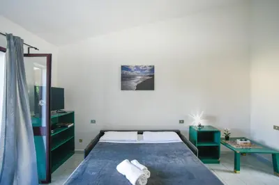 Letto o letti in una camera di Su Nenneri Beach Apartment