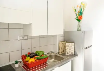 Cucina o angolo cottura di Su Nenneri Beach Apartment