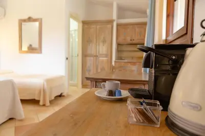Letto o letti in una camera di Porto Giunco Residence