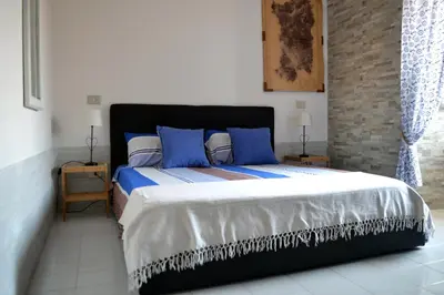 Letto o letti in una camera di Via Marina 19 - Casa sul mare.