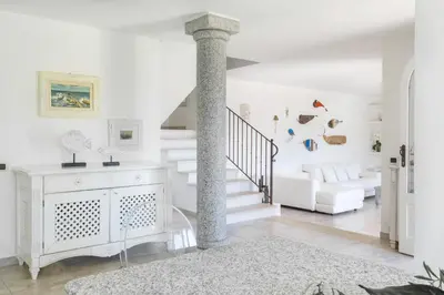 Letto o letti in una camera di Villa Ulivo con piscina e giardino privato a 500 mt dal mare