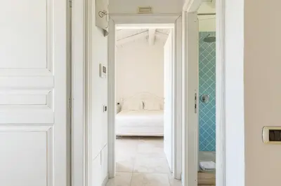 Letto o letti in una camera di Villa Ulivo con piscina e giardino privato a 500 mt dal mare