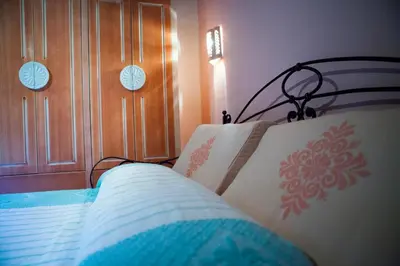 Letto o letti in una camera di S'Incantu Resort