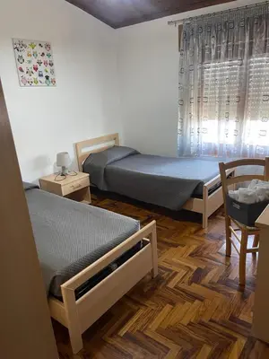 Letto o letti in una camera di B&B da Antonella
