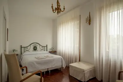 Letto o letti in una camera di Locanda dei Buoni e Cattivi