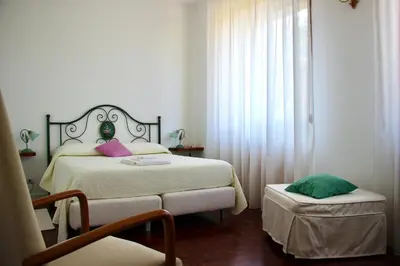 Letto o letti in una camera di Locanda dei Buoni e Cattivi
