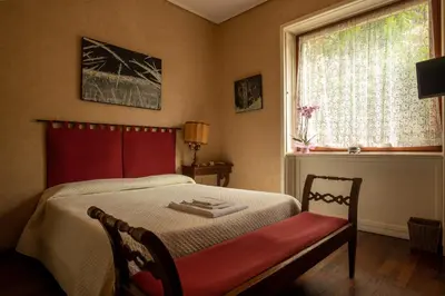 Letto o letti in una camera di Locanda dei Buoni e Cattivi