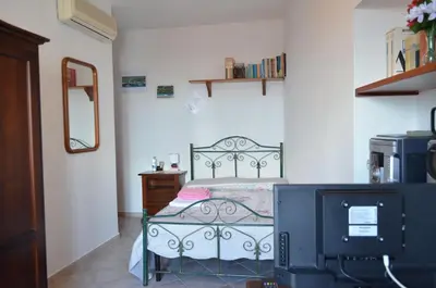 Letto o letti in una camera di B&B Belvedere