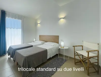 Letto o letti in una camera di Appartamenti Shardana