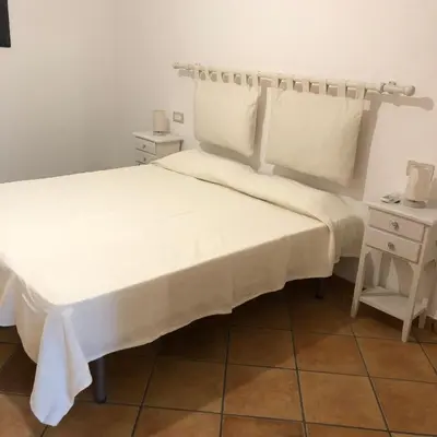 Letto o letti in una camera di Casa della Nonna