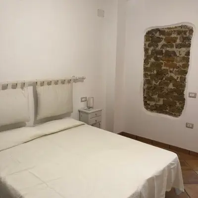 Letto o letti in una camera di Casa della Nonna