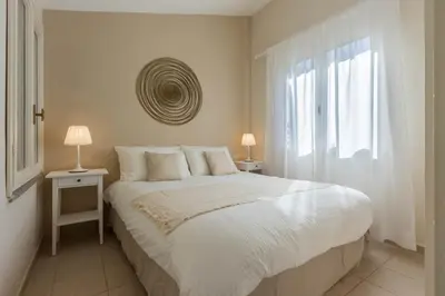 Letto o letti in una camera di Villa Luna - Vacanza a Villasimius vicino alle spiagge più rinomate della costa