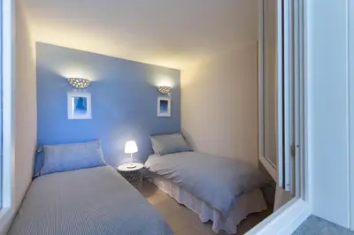 Letto o letti in una camera di Villa Luna - Vacanza a Villasimius vicino alle spiagge più rinomate della costa