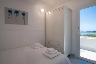 Letto o letti in una camera di SUL MARE SARDEGNA VILLA ALIE