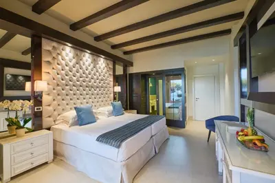 Letto o letti in una camera di Forte Village Resort - Il Castello