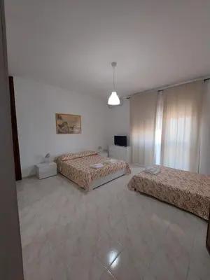 Letto o letti in una camera di Domus Dejanas - Appartamento 180 mq a Quartu