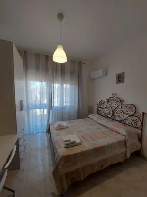 Letto o letti in una camera di Domus Dejanas - Appartamento 180 mq a Quartu